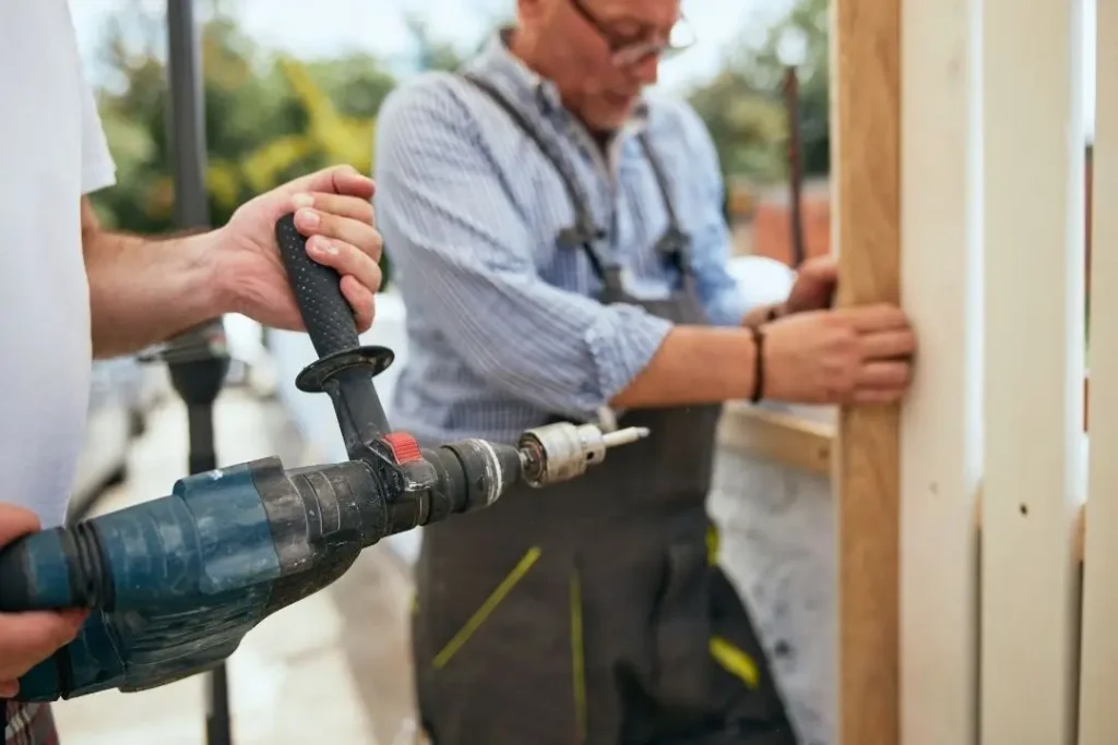 contractors installing a timber fence