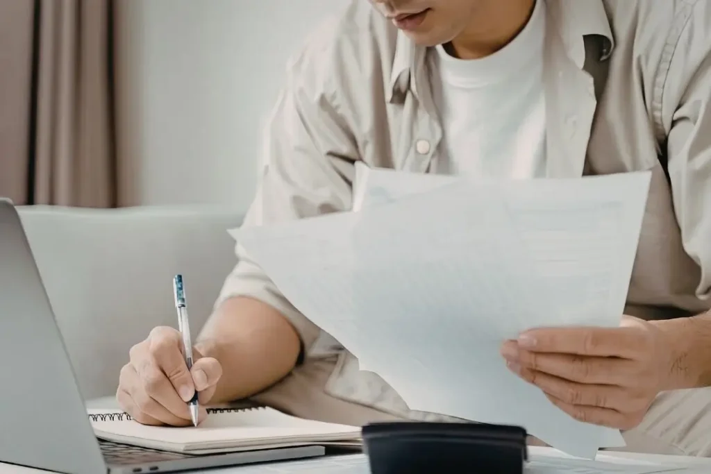 homeowner taking notes on quotes